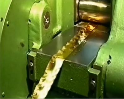 Gold being rolled into a ribbon